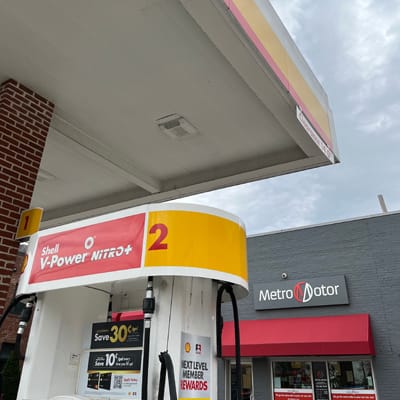 Front of Metro Motor auto repair shop and gas station in Alexandria