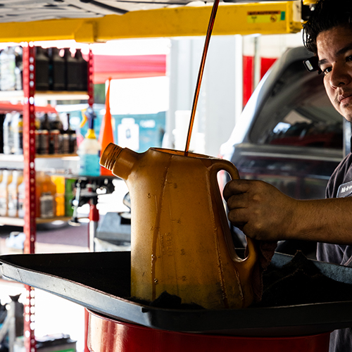 Metro Motor auto repair technician completes an oil change on a vehicle in D.C.
