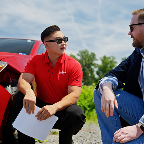 Metro Motor collision repair estimator meets with a driver to discuss auto body repairs