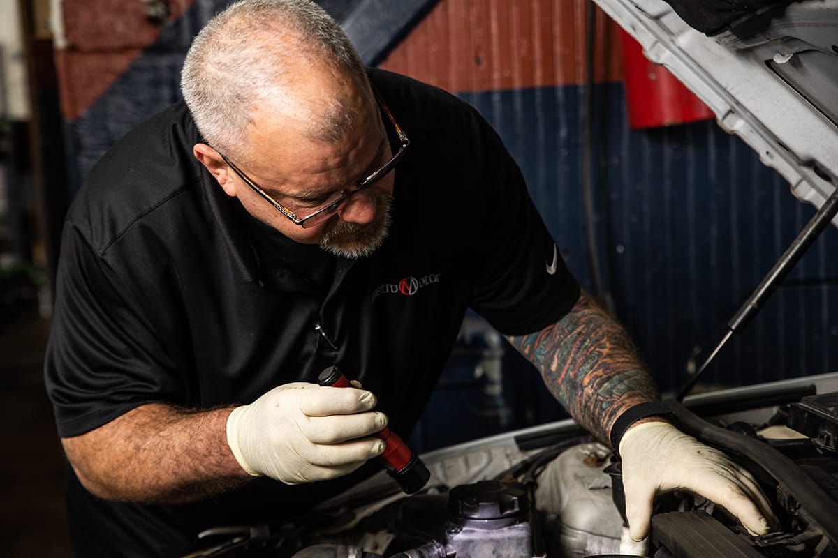 Emissions and safety technician inspects a vehicle in Virginia