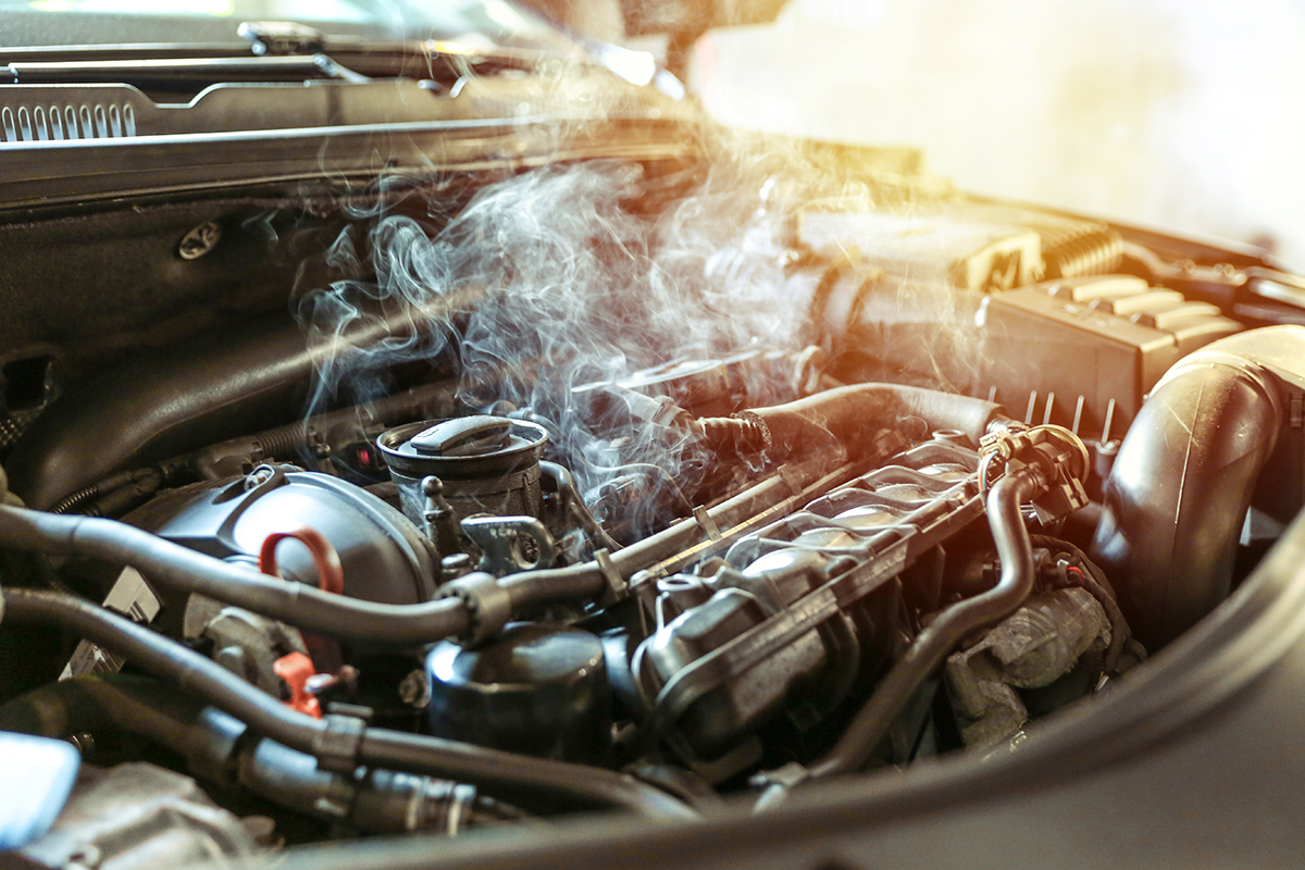 How Hot Weather Affects Car Performance, Smoke Rising from Open Engine