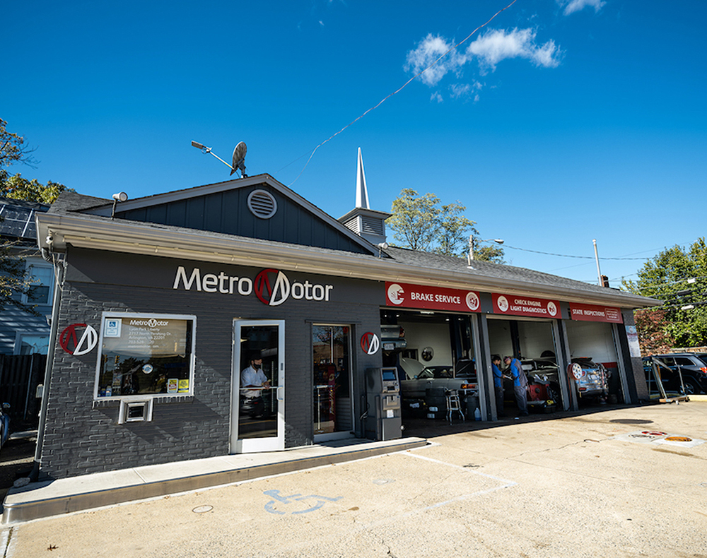 An exterior view of the Metro Motor auto repair shop in Clarendon, Virginia