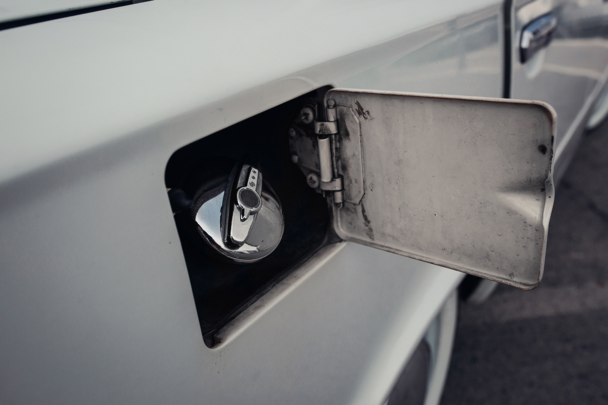 The fuel door is open on a vintage truck.