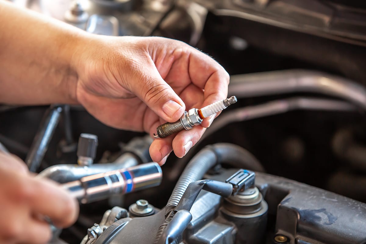 Detail of spark plugs over an engine.