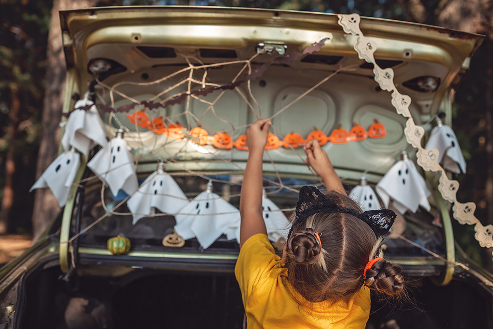 Girl Decorates Vehicle for Trunk or Treating on Halloween