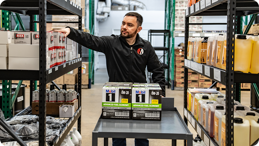 Auto supply warehouse manager pulls product for auto repair shop