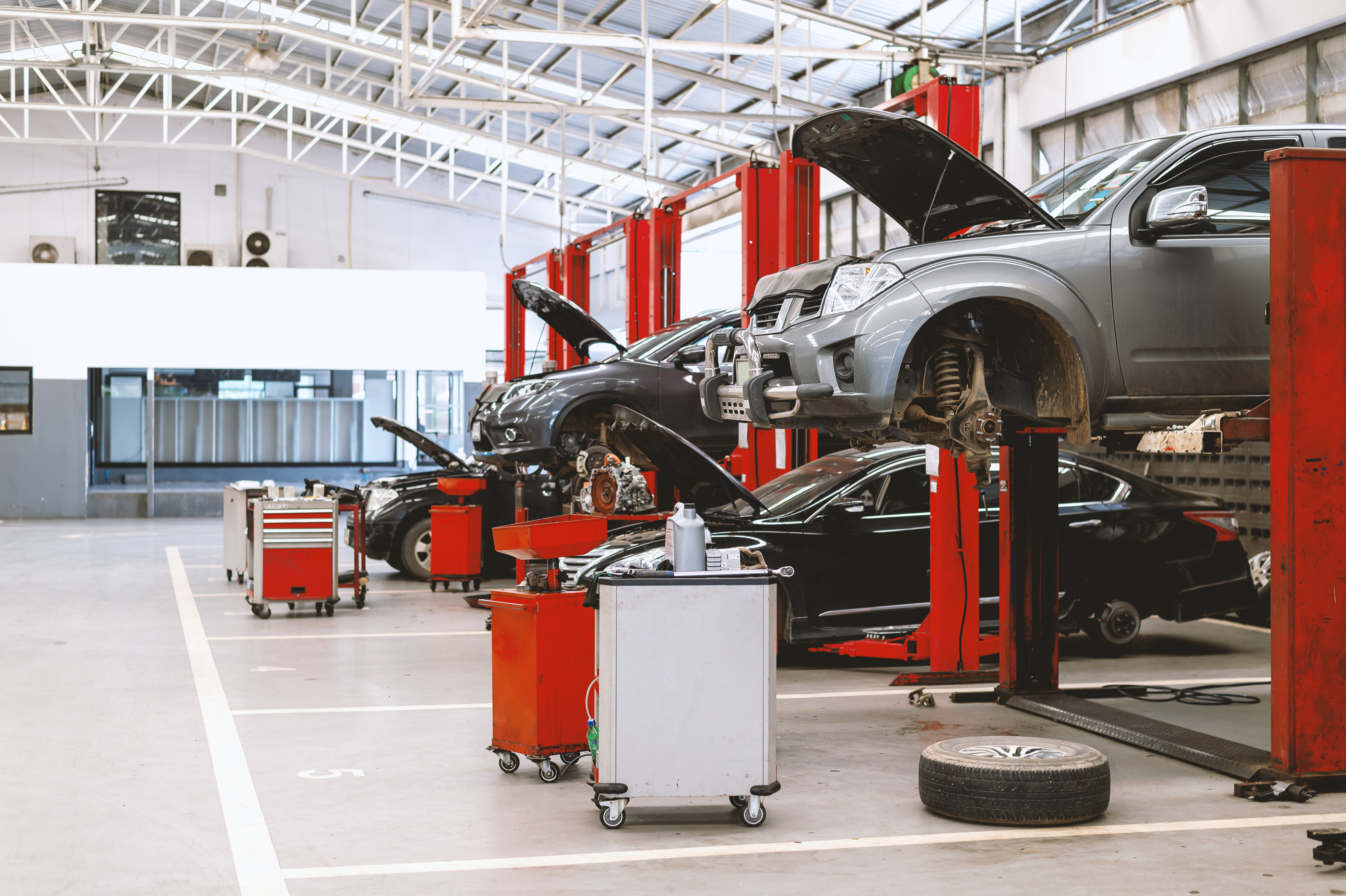 Line of cars on mechanic bays