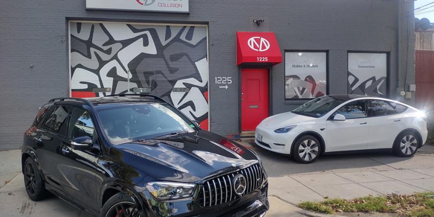 Two repaired vehicles are parked in front of the Metro Motor collision repair shop in Washington, DC