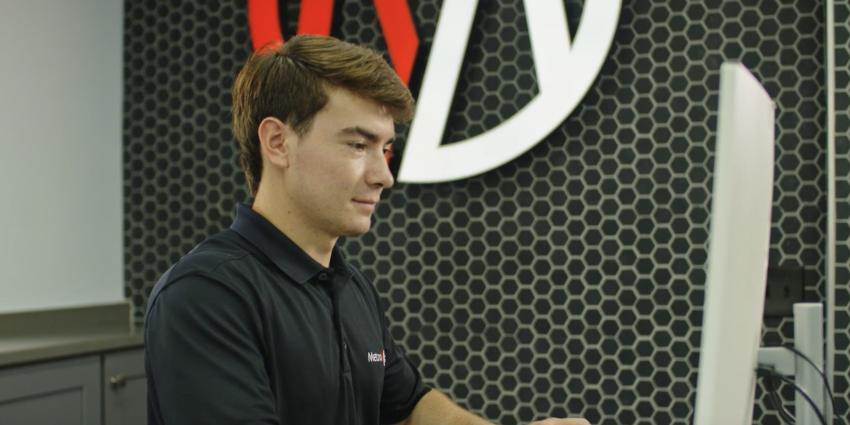 A Metro Motor service advisor works in the auto repair shop
