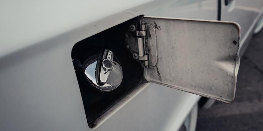 The fuel door is open on a vintage truck.