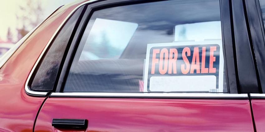 For Sale Sign in a Used Car Window