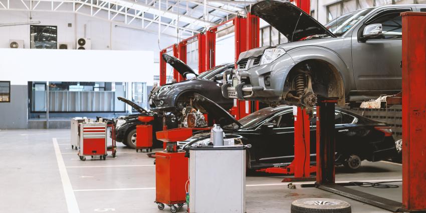 Line of cars on mechanic bays