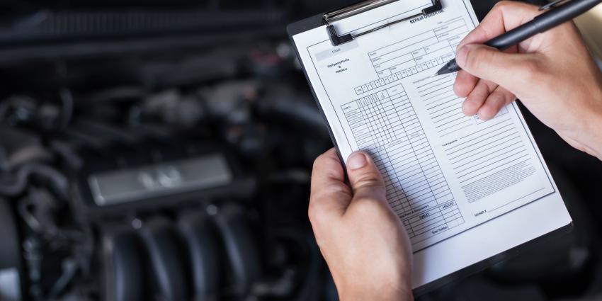 Vehicle inspection checklist with car engine in background